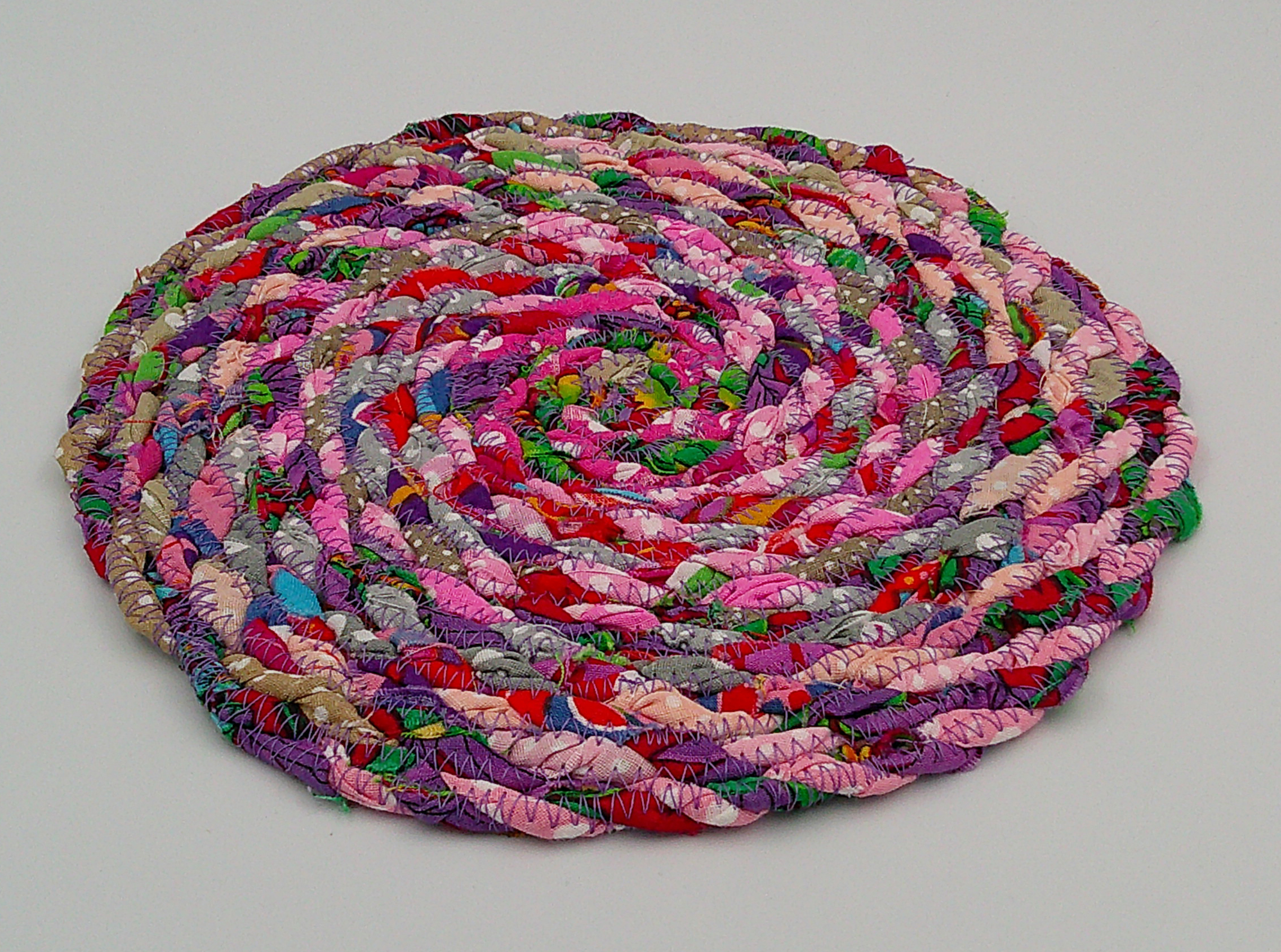 This view shows a different angle of the trivet. It is approximately 1/4 inch thick. This view shows a different angle of the trivet. It is approximately 1/4 inch thick.